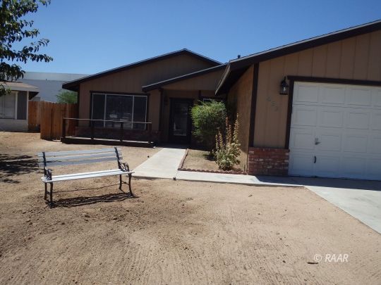 633 South Gemstone Street Ridgecrest, CA 93555 - Photo 1 of 35 a view of house with backyard and sitting area
