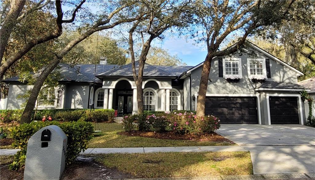 2551 Regal River Road Valrico, FL 33596 - Photo 1 of 1 a front view of a house with garden