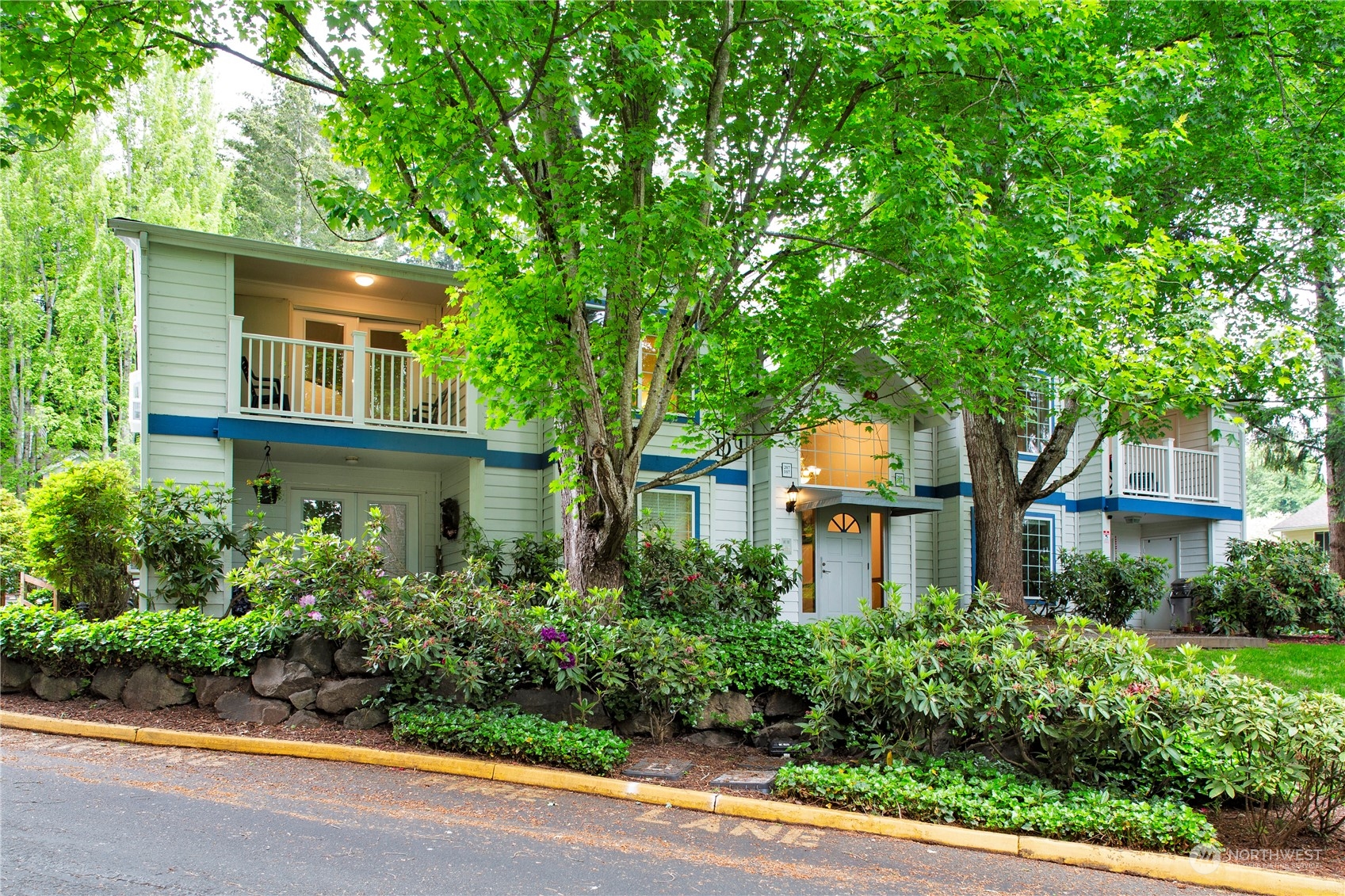 8653 Avondale Road Northeast, Unit D207 Redmond, WA 98052 - Photo 1 of 21 front view of a house with a yard