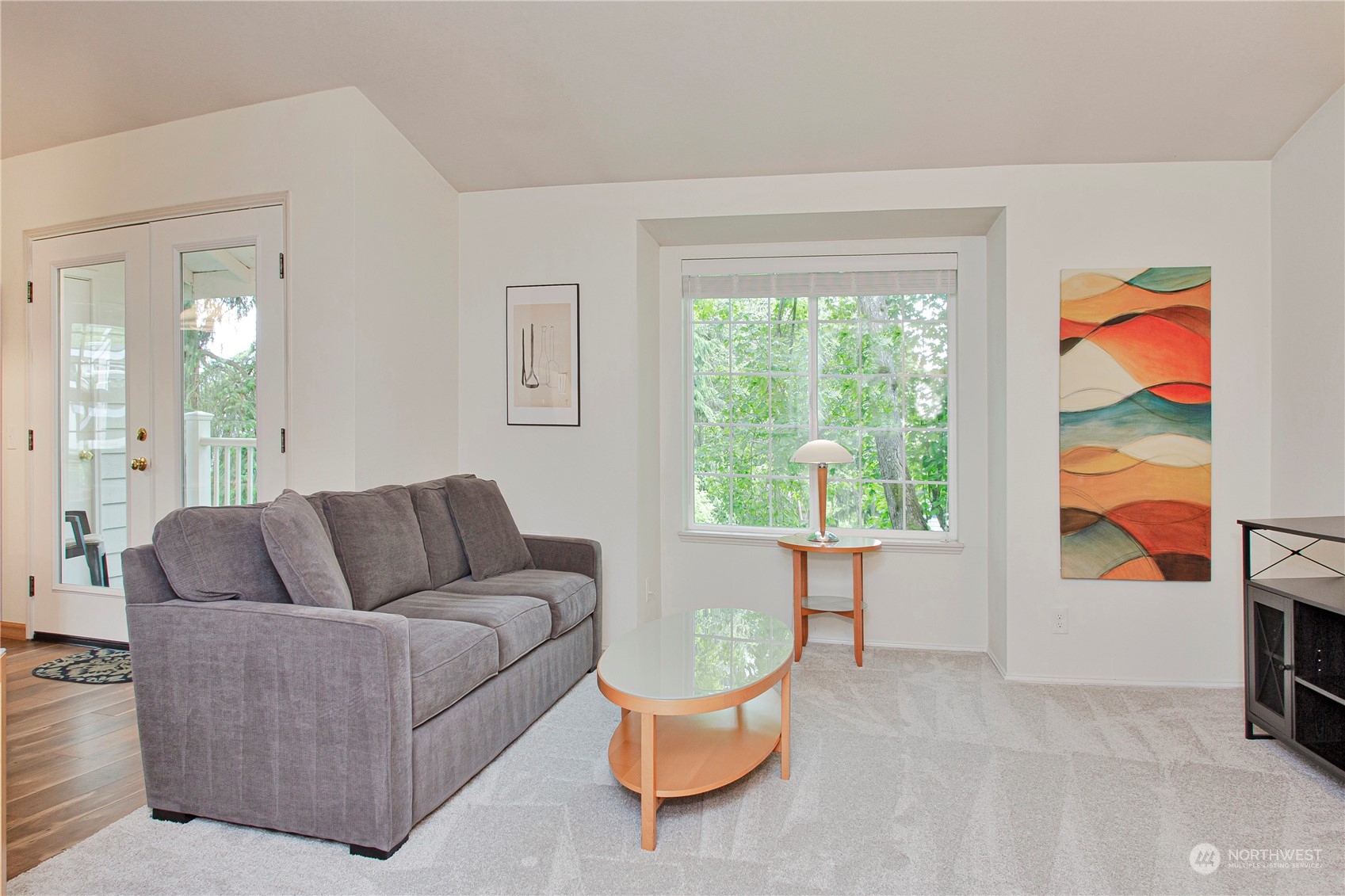 8653 Avondale Road Northeast, Unit D207 Redmond, WA 98052 - Photo 12 of 21 a living room with furniture and a large window