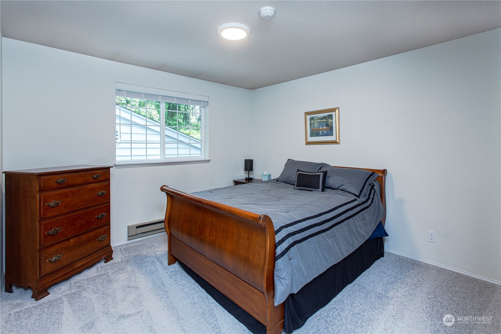 8653 Avondale Road Northeast, Unit D207 Redmond, WA 98052 - Photo 13 of 21 a bedroom with a bed and window