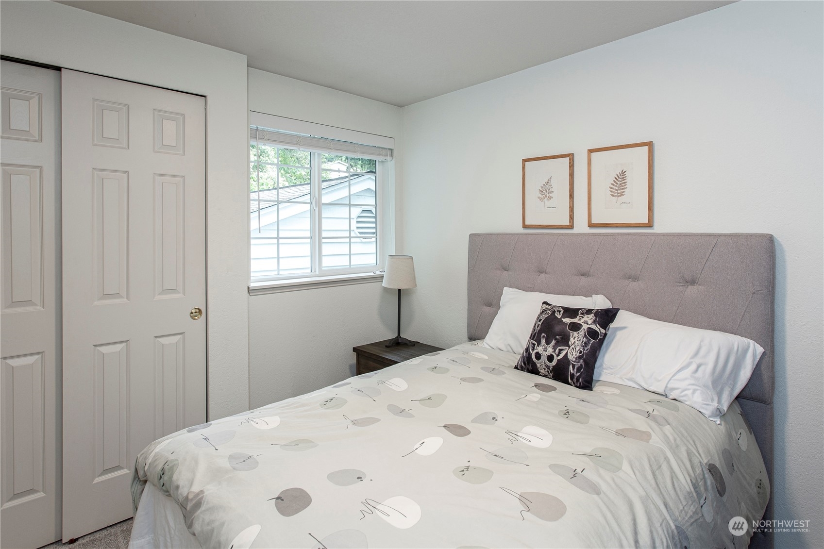 8653 Avondale Road Northeast, Unit D207 Redmond, WA 98052 - Photo 16 of 21 a large bed sitting in a bedroom next to a window
