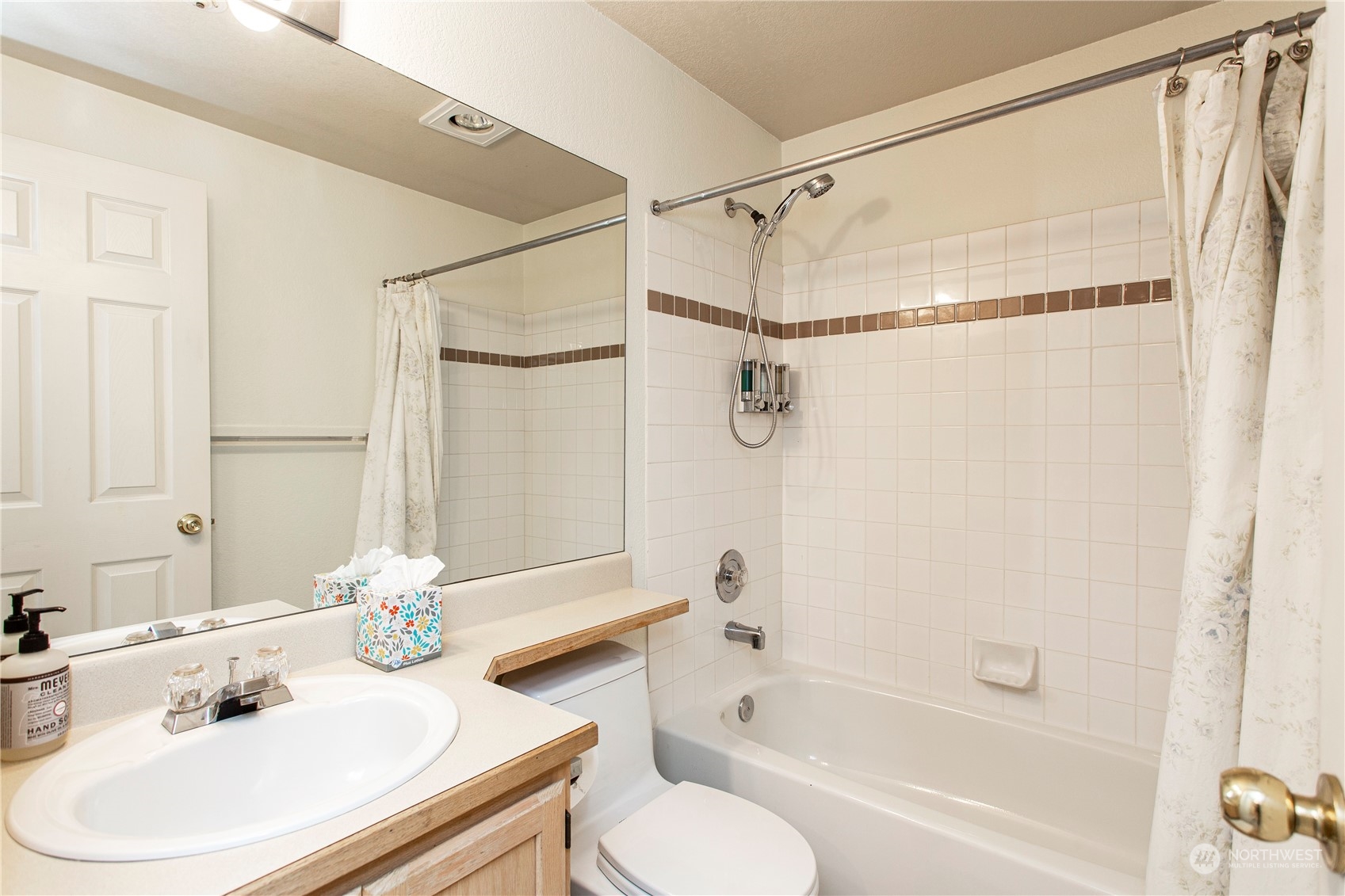 8653 Avondale Road Northeast, Unit D207 Redmond, WA 98052 - Photo 17 of 21 a bathroom with a sink toilet and shower