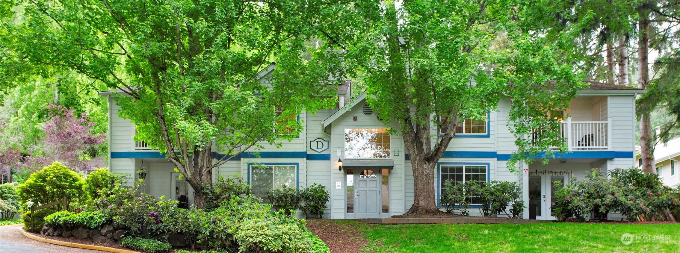 8653 Avondale Road Northeast, Unit D207 Redmond, WA 98052 - Photo 20 of 21 front view of a house with a yard