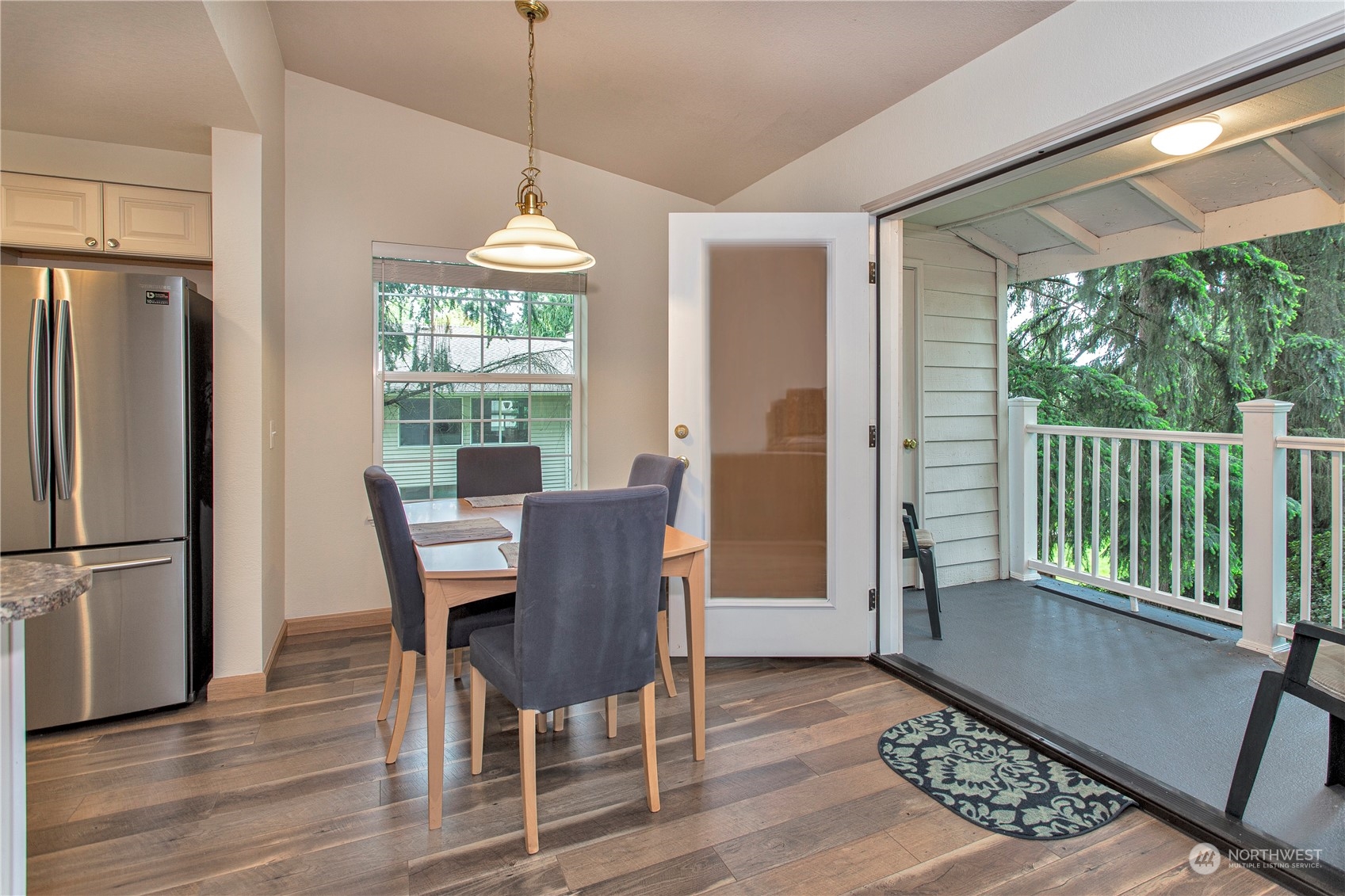 8653 Avondale Road Northeast, Unit D207 Redmond, WA 98052 - Photo 2 of 21 a view of a dining room with furniture window and wooden floor