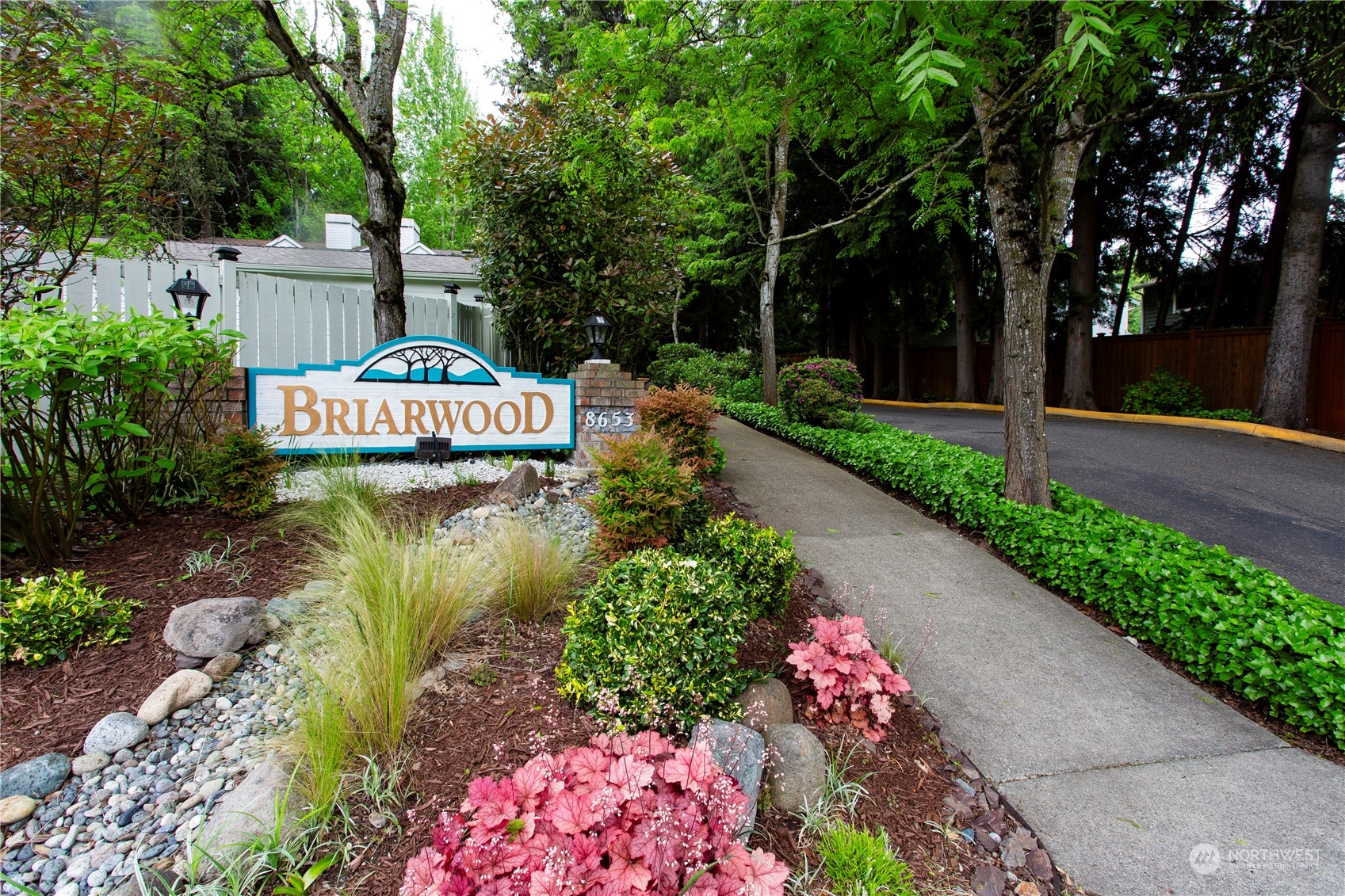 8653 Avondale Road Northeast, Unit D207 Redmond, WA 98052 - Photo 21 of 21 a front view of a house with garden