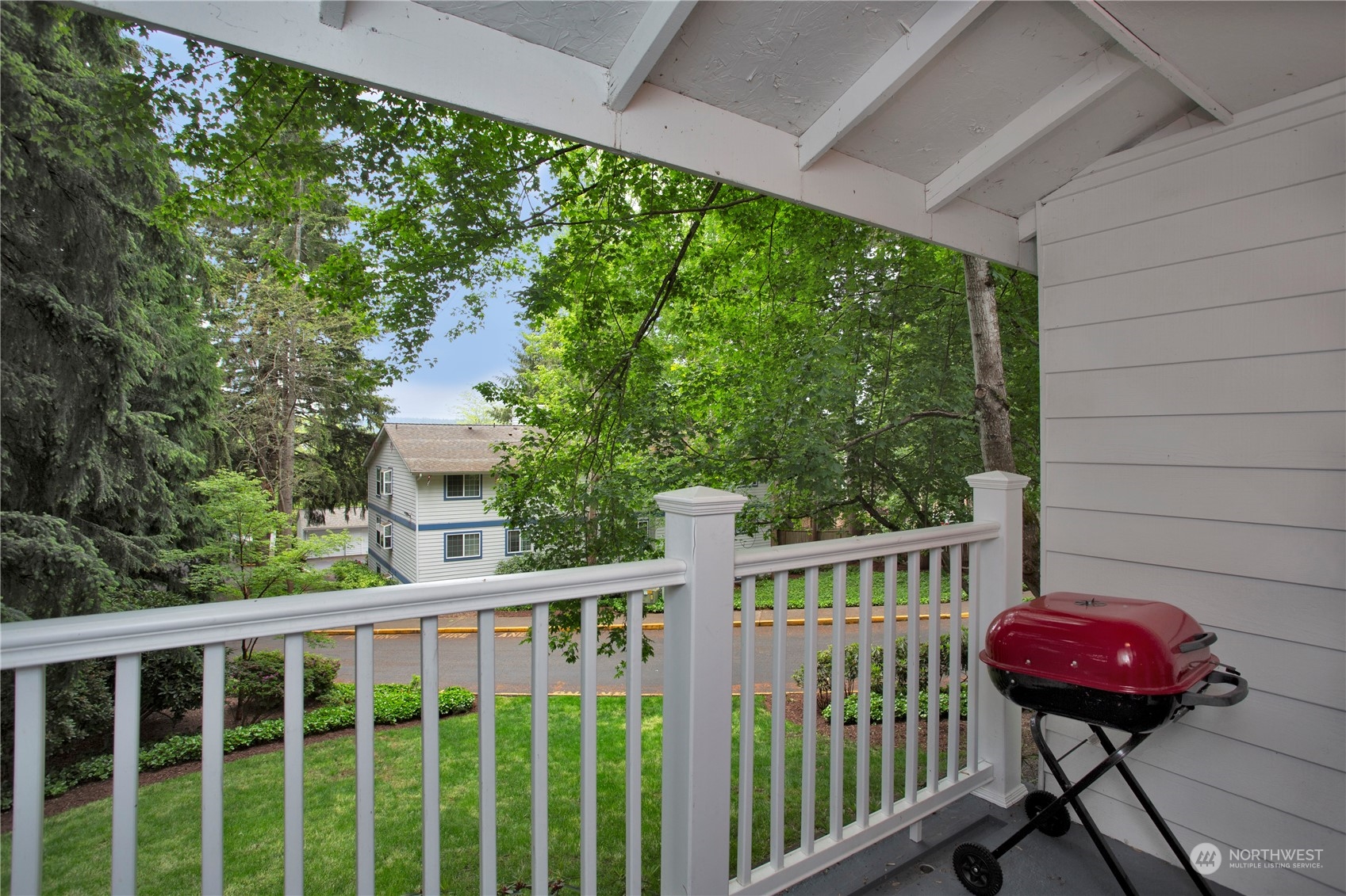8653 Avondale Road Northeast, Unit D207 Redmond, WA 98052 - Photo 4 of 21 a view of a porch with furniture and yard