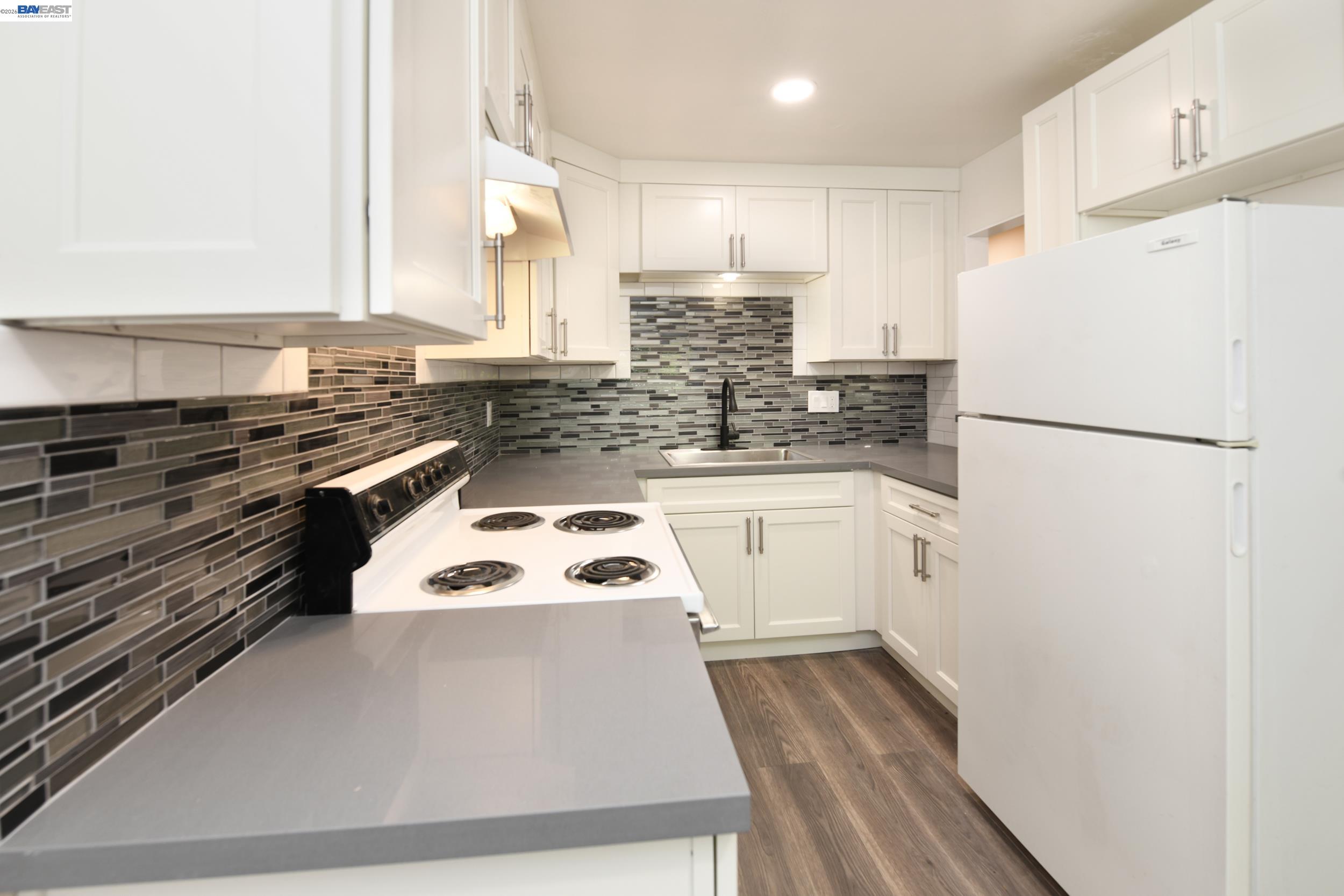 205 Muir Road Martinez, CA 94553 - Photo 6 of 20 a white refrigerator freezer sitting inside of a kitchen