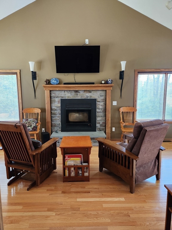153 County Road Rochester, MA 02576 - Photo 3 of 39 a living room with furniture a flat screen tv and a fireplace