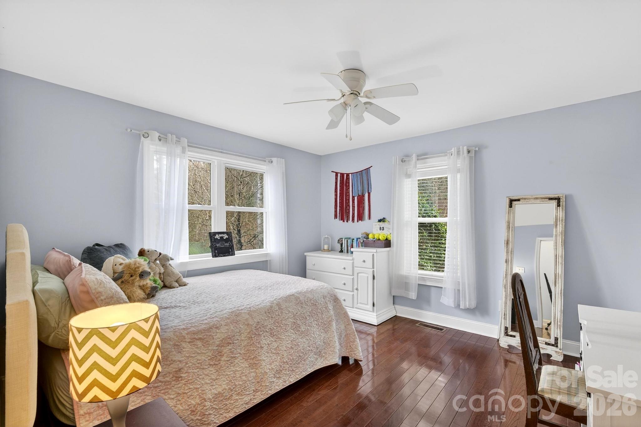 343 Hoyles Creek Road Dallas, NC 28034 - Photo 15 of 31 a bedroom with a bed and wooden floor