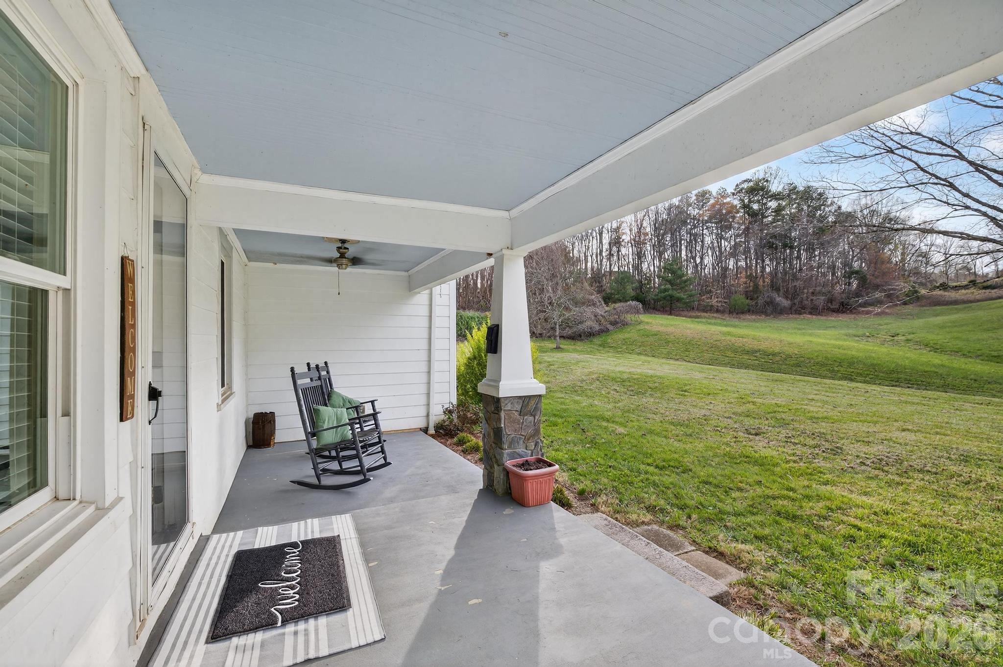 343 Hoyles Creek Road Dallas, NC 28034 - Photo 25 of 31 a view of a porch with furniture and garden