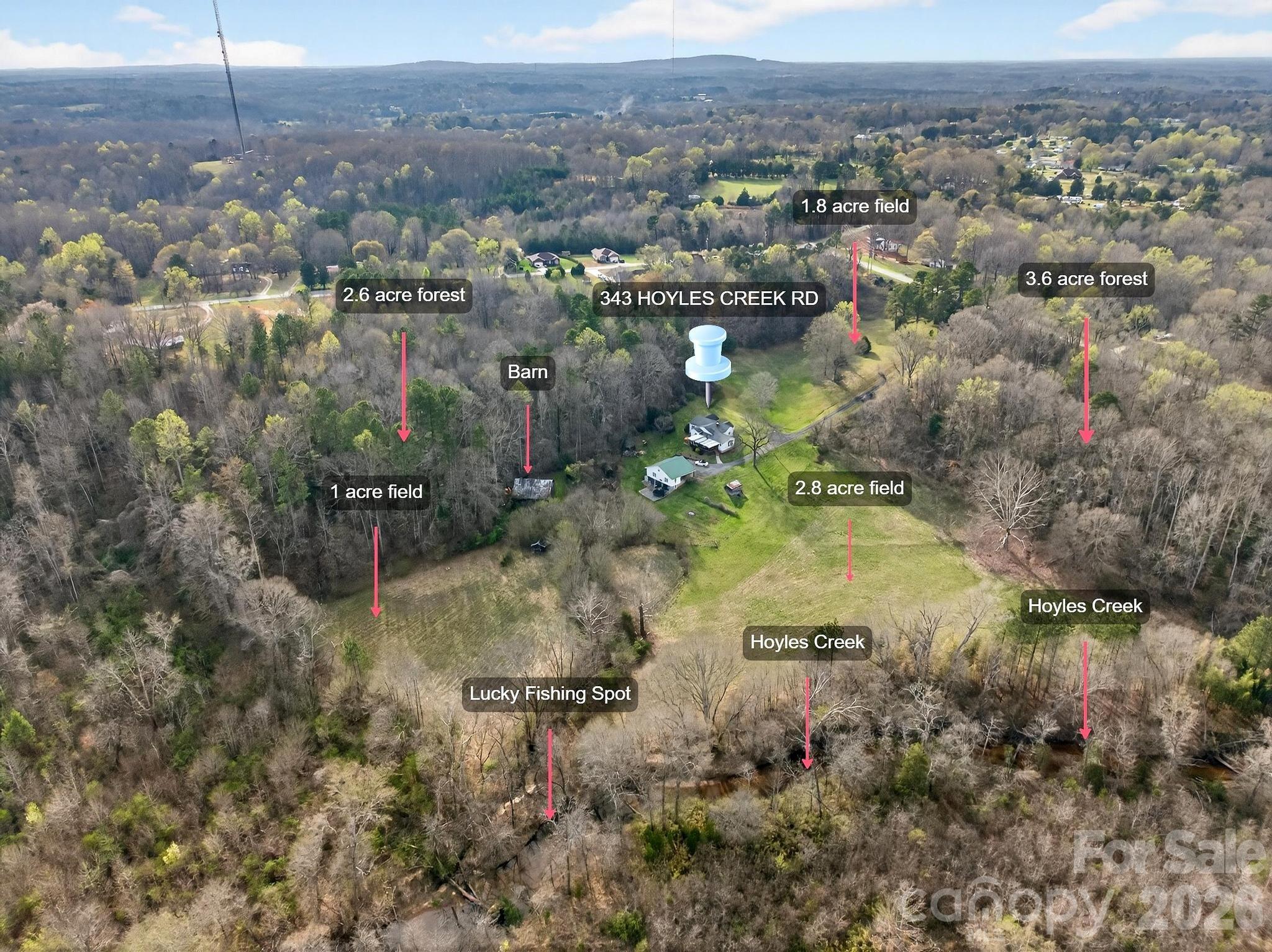 343 Hoyles Creek Road Dallas, NC 28034 - Photo 29 of 31 a view of a lake with a city