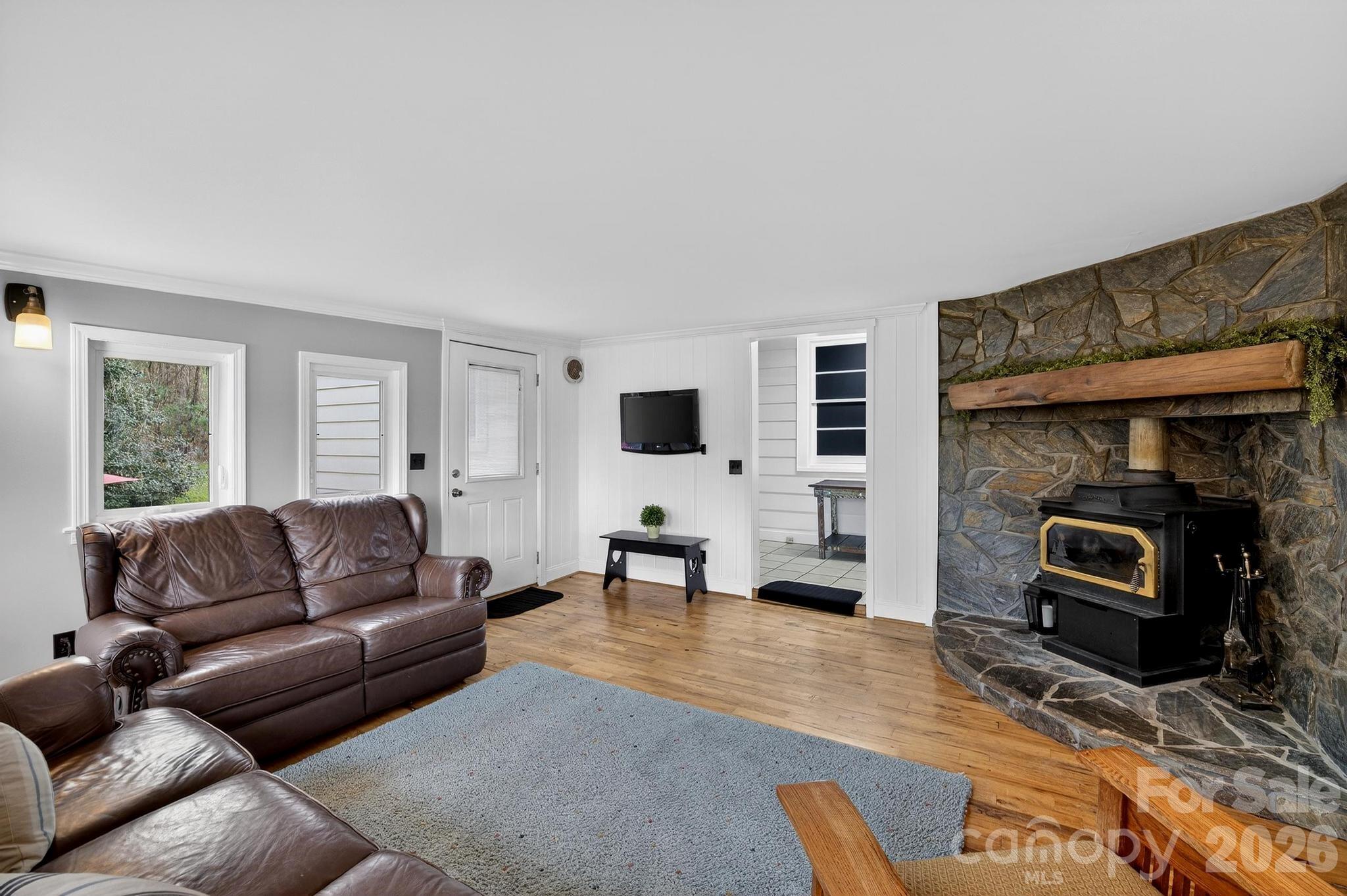 343 Hoyles Creek Road Dallas, NC 28034 - Photo 31 of 31 a living room with furniture and a flat screen tv