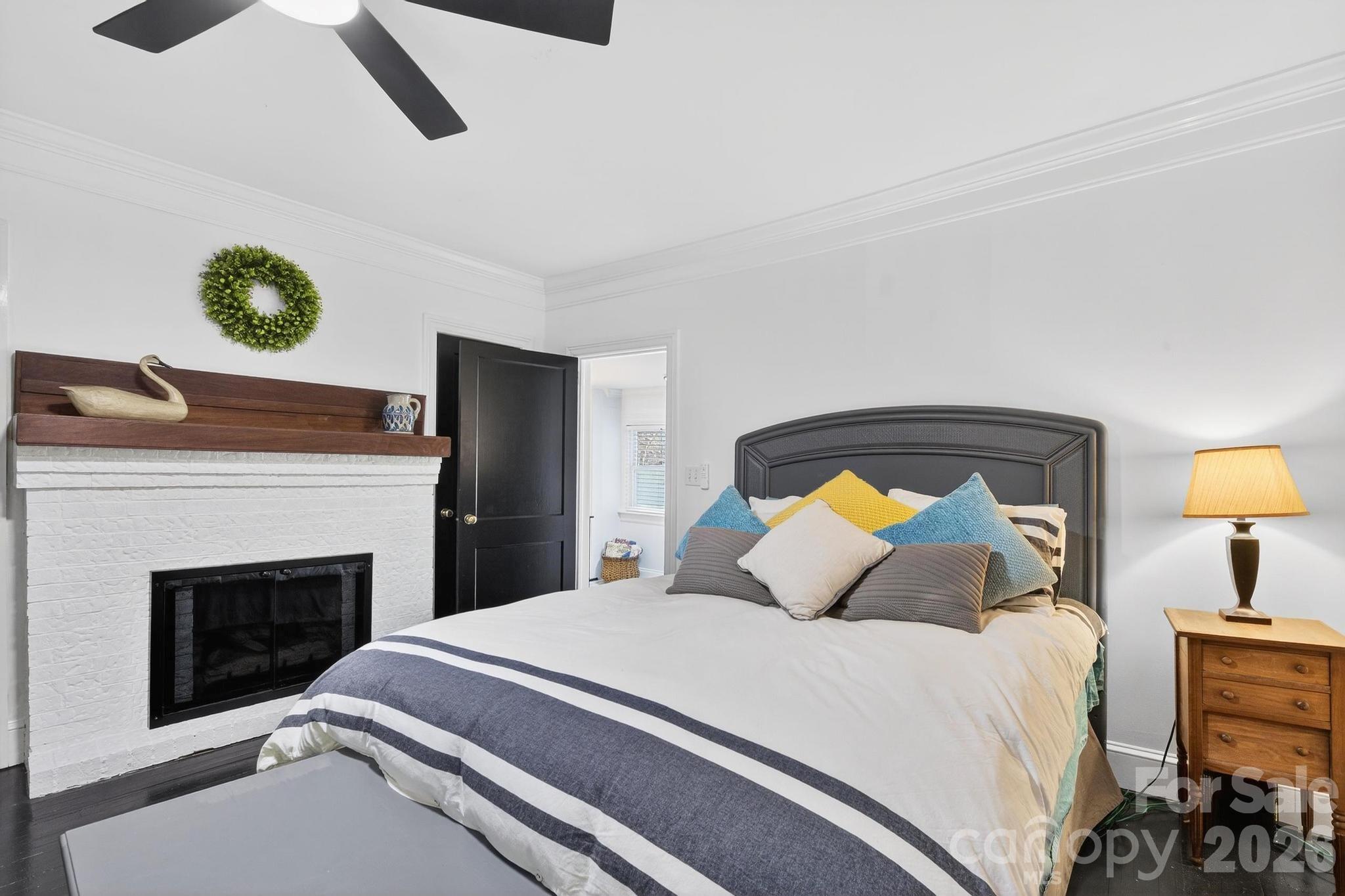 343 Hoyles Creek Road Dallas, NC 28034 - Photo 4 of 31 a bedroom with a bed and lamps