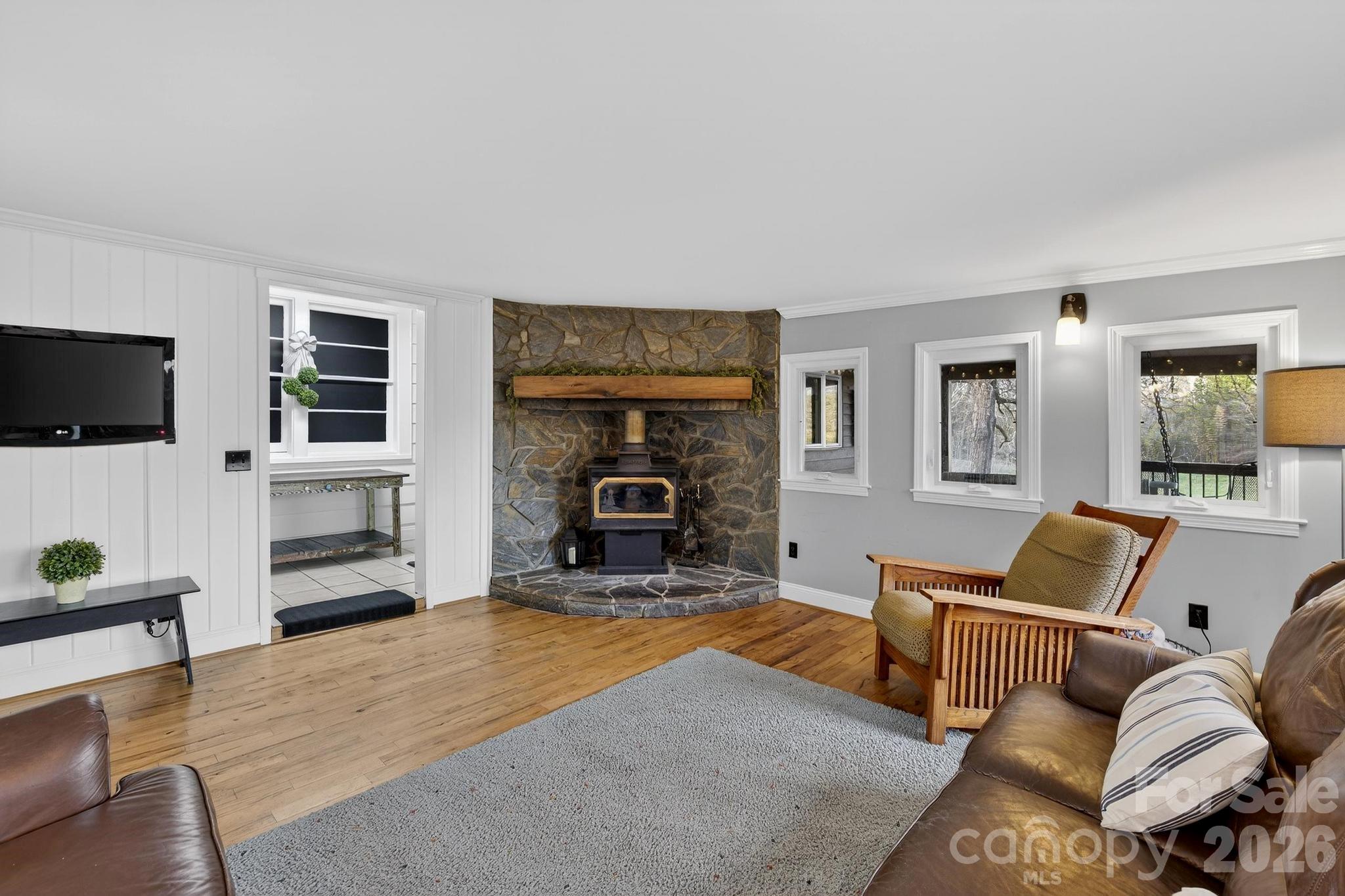 343 Hoyles Creek Road Dallas, NC 28034 - Photo 5 of 31 a living room with furniture fireplace and flat screen tv