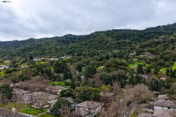 an aerial view of a city with lawn chairs