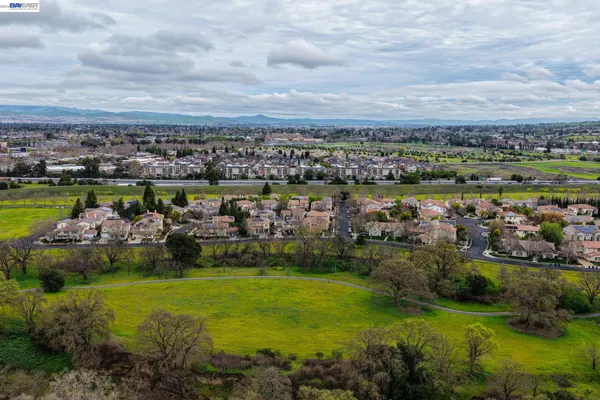 an aerial view of residential houses with outdoor space