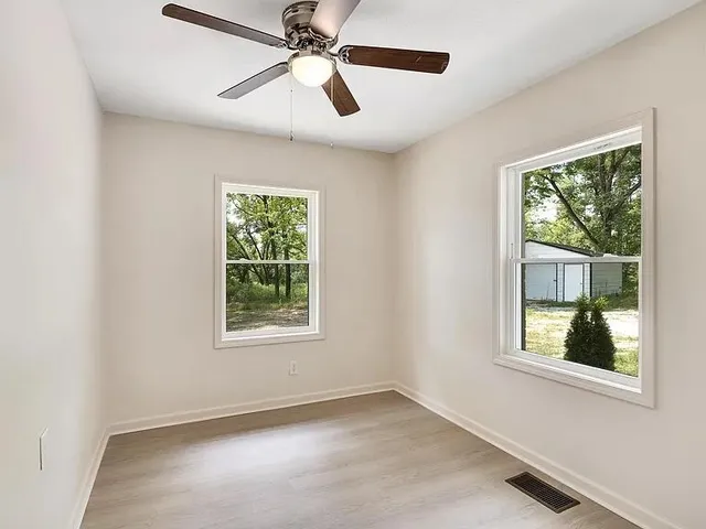 a view of an empty room with a window