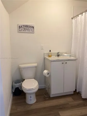 a bathroom with a toilet and a sink