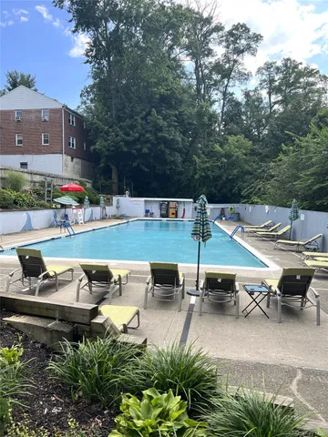 an aerial view of a house with swimming pool garden view