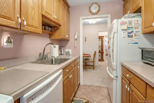 a kitchen with a sink and a stove top oven