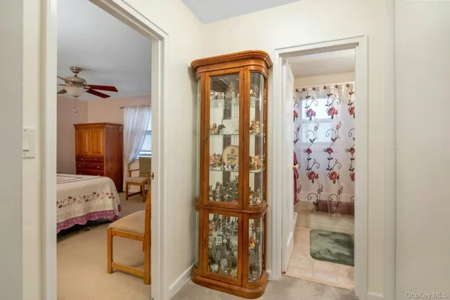 a bedroom with a bed and a mirror