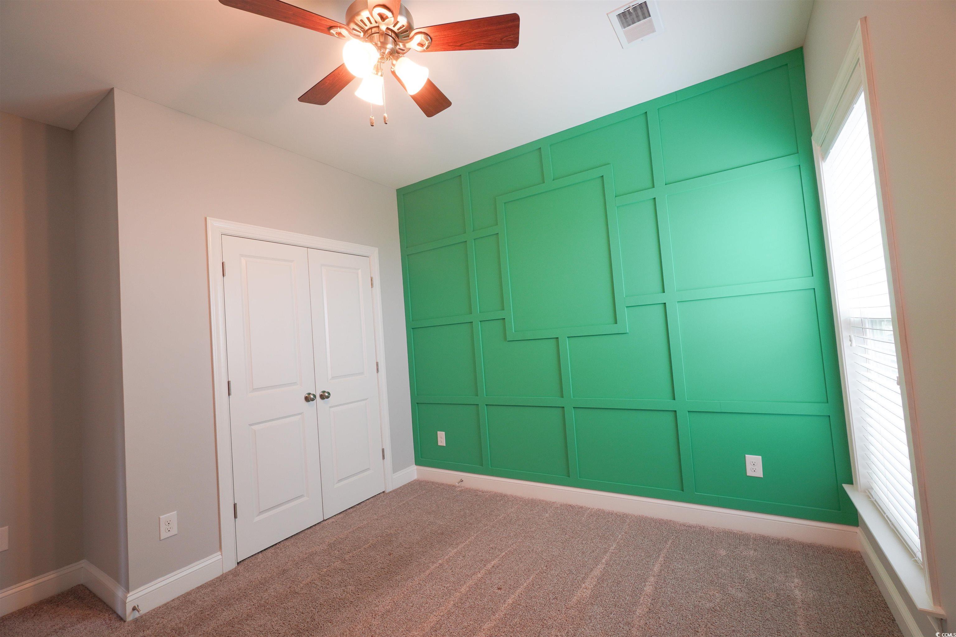 100 Splendor Circle Murrells Inlet, SC 29576 - Photo 11 of 40 Lower level bedroom featuring carpet, a ceiling fan, and a closet
