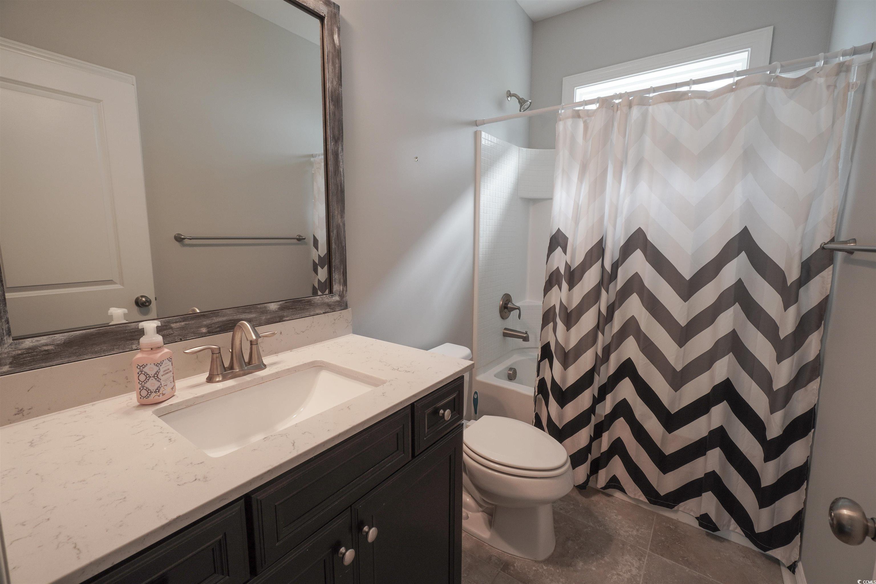 100 Splendor Circle Murrells Inlet, SC 29576 - Photo 12 of 40 Bathroom with vanity and shower / bathtub combination with curtain