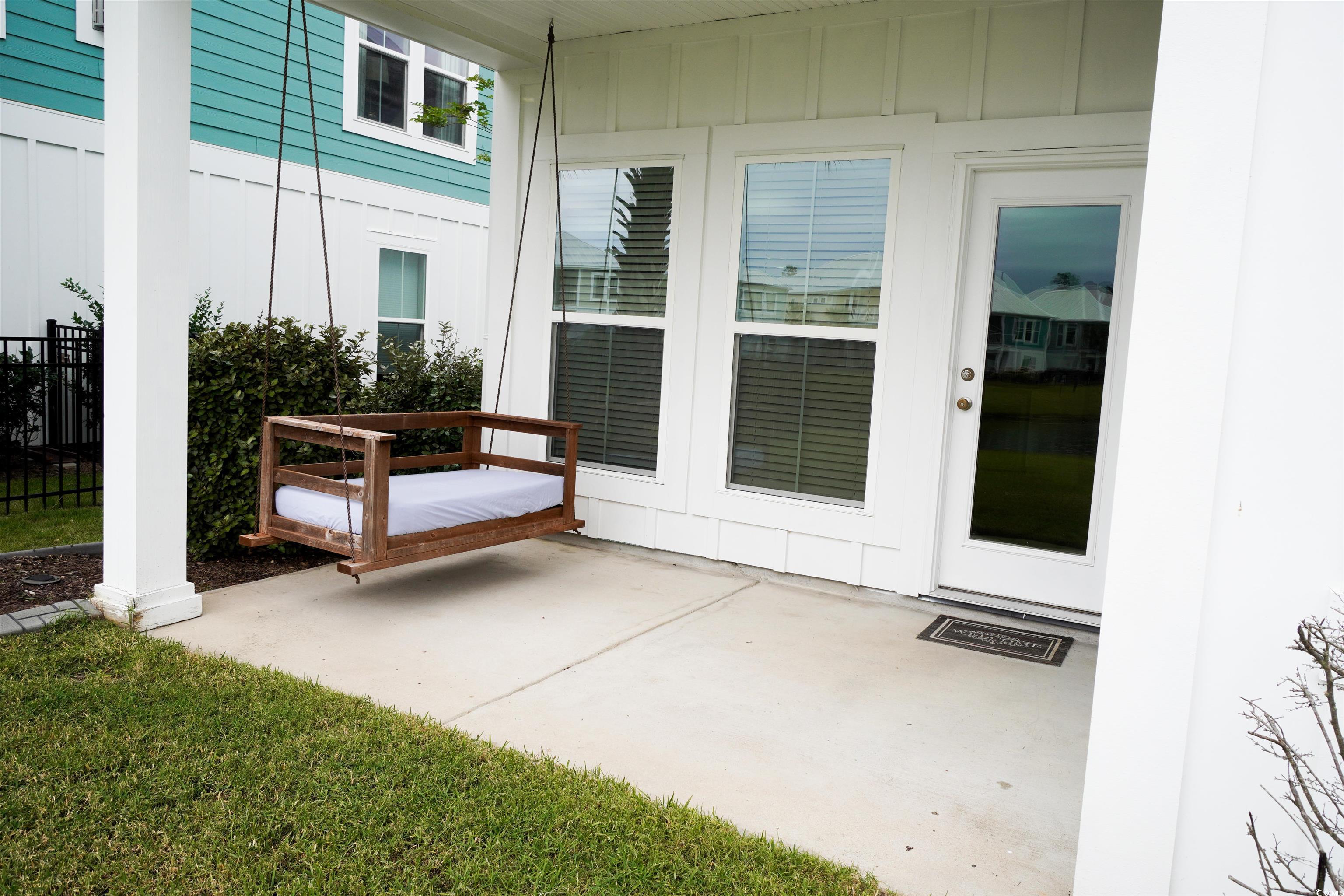 100 Splendor Circle Murrells Inlet, SC 29576 - Photo 30 of 40 Back yard patio and a swing