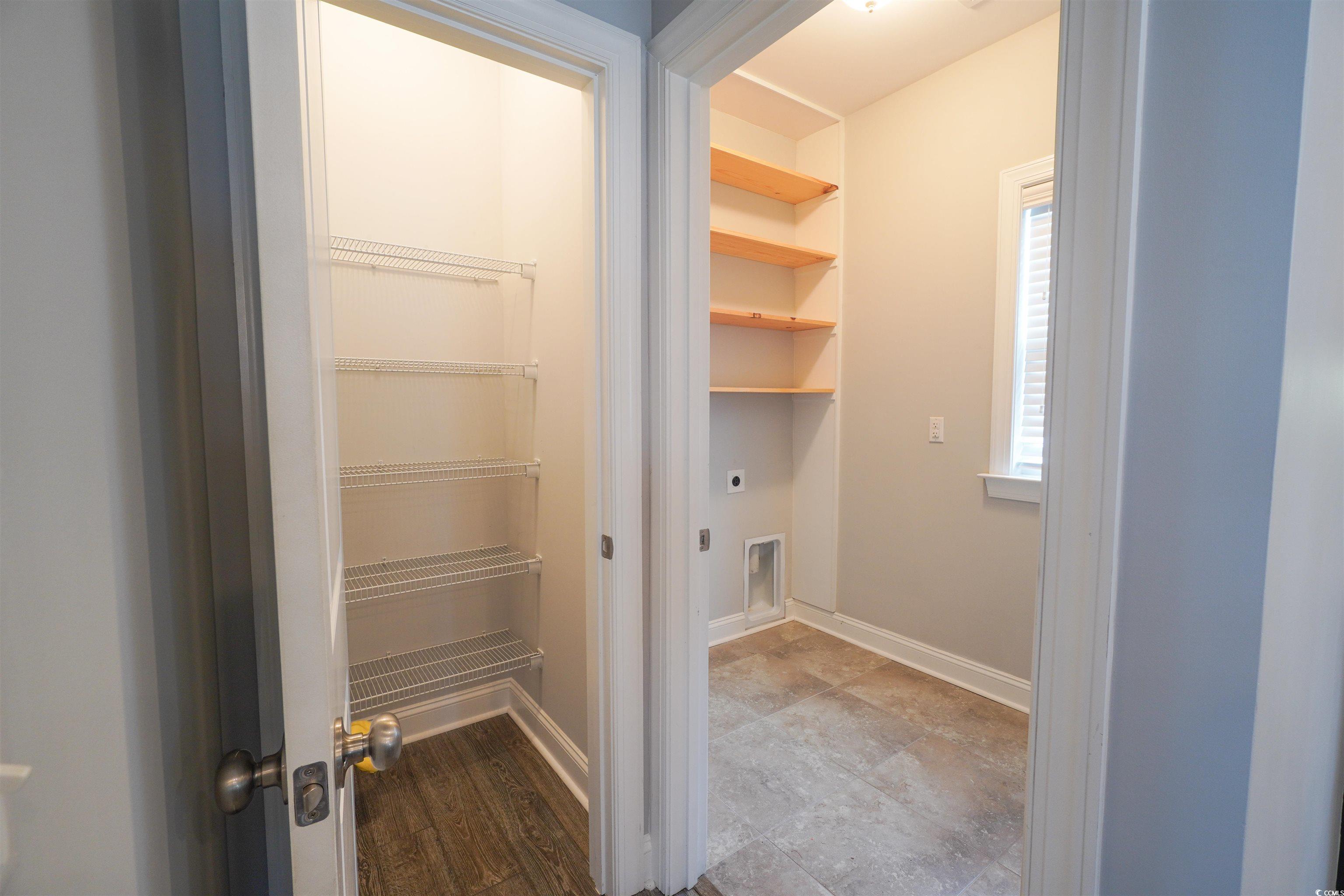 100 Splendor Circle Murrells Inlet, SC 29576 - Photo 35 of 40 Laundry room featuring hookup for washer/dryer and custom shelving