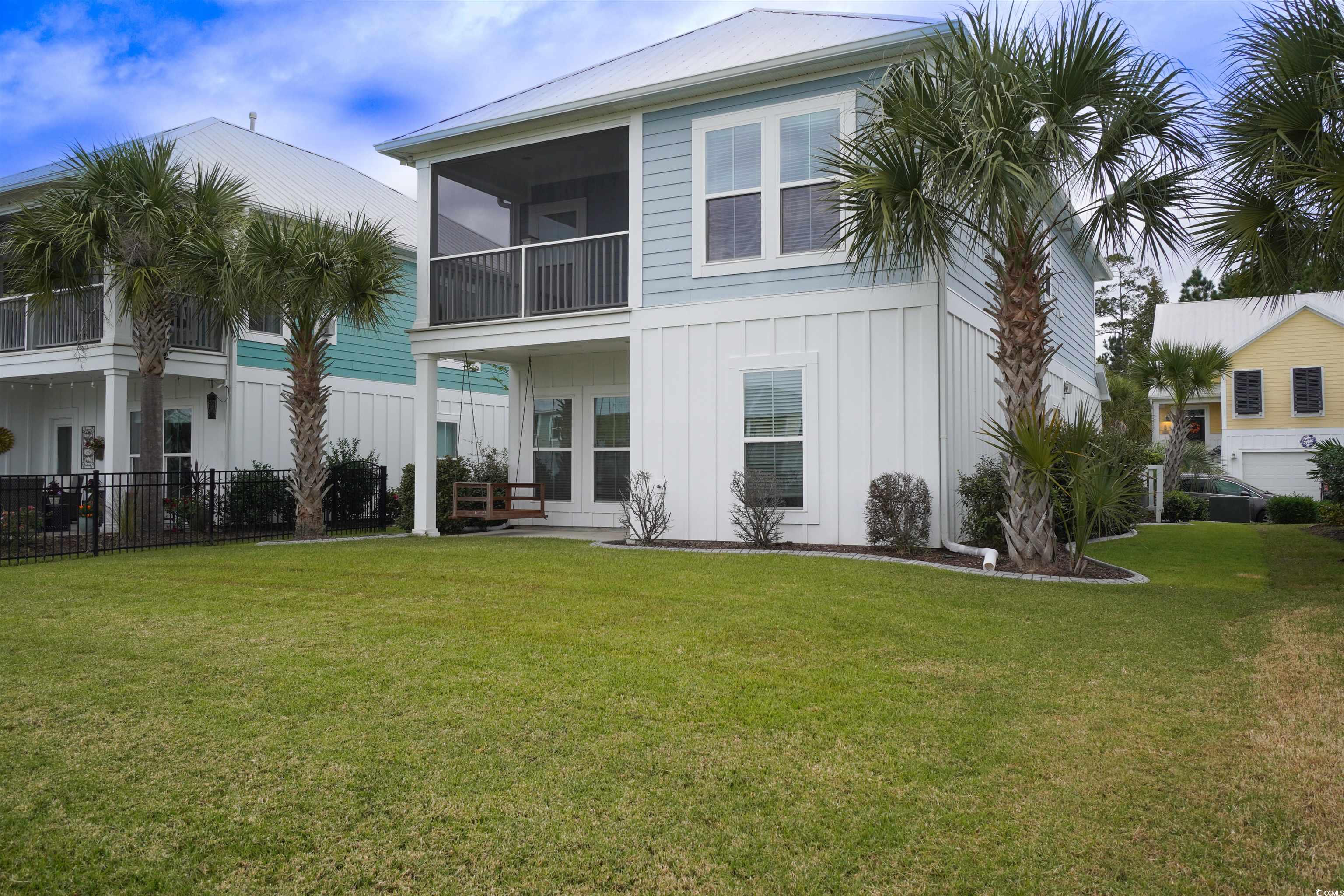 100 Splendor Circle Murrells Inlet, SC 29576 - Photo 4 of 40 Rear view of house. a balcony, a sunroom, and a patio