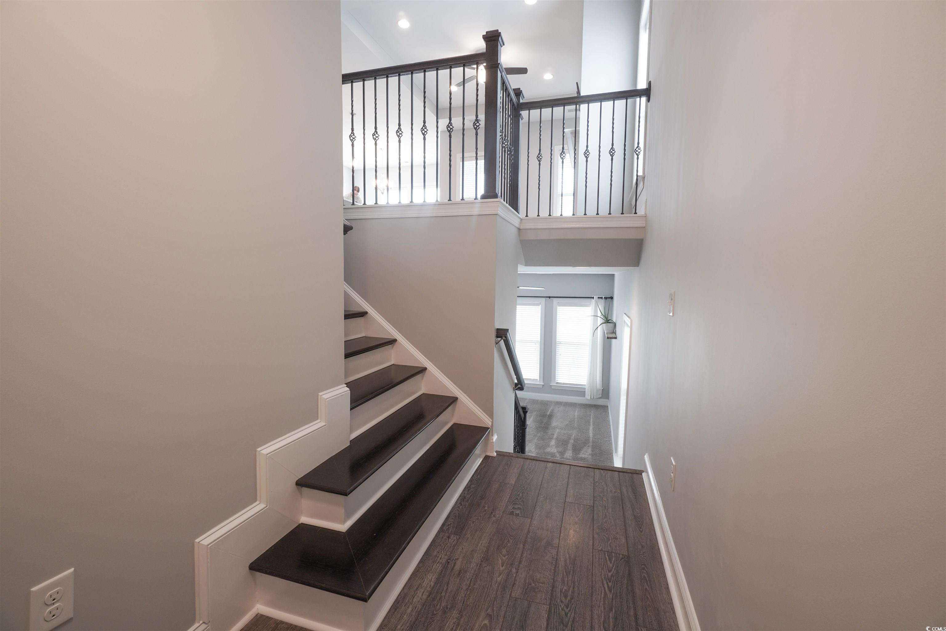 100 Splendor Circle Murrells Inlet, SC 29576 - Photo 5 of 40 Staircase with a high ceiling, wood finished floors, and recessed lighting