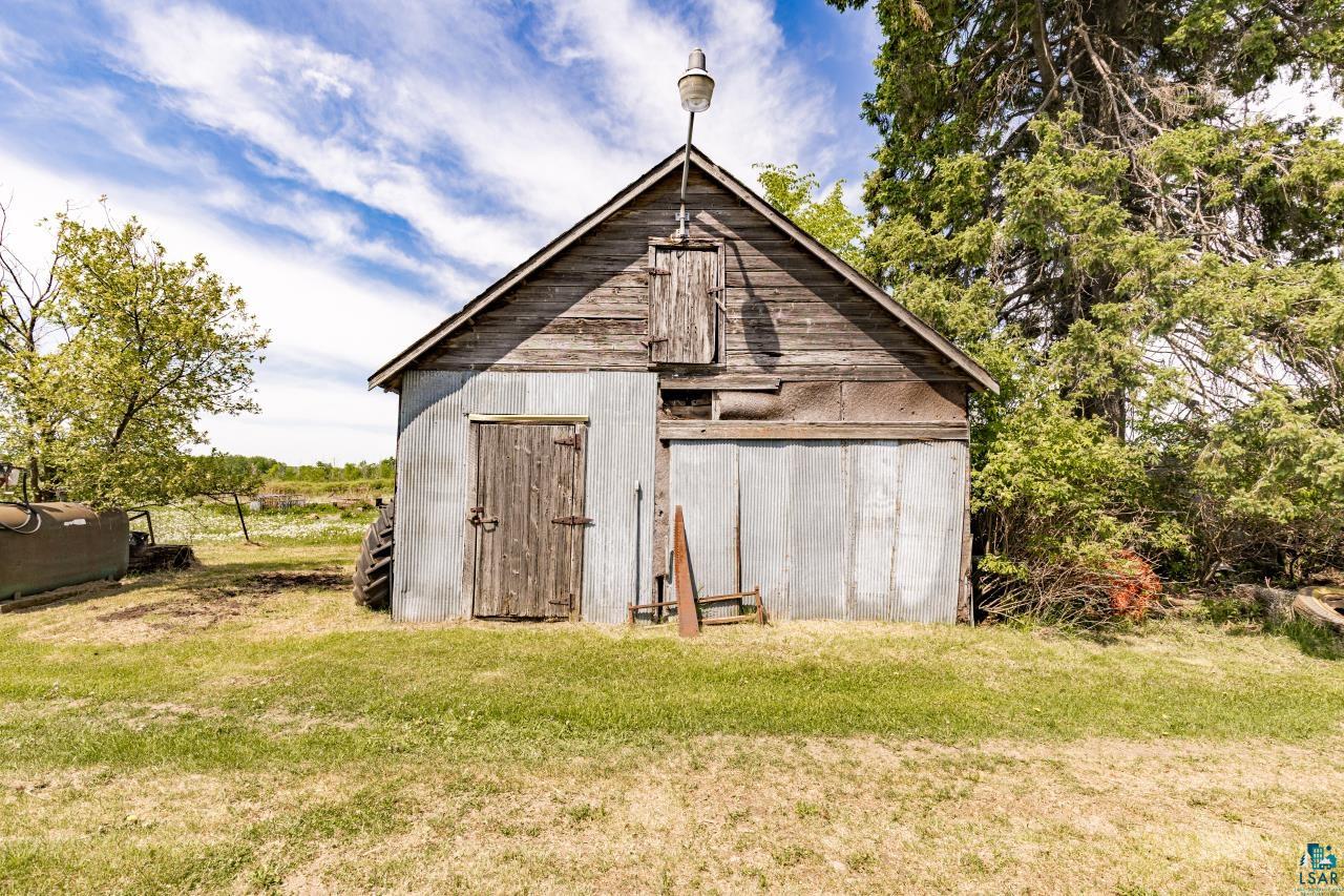 6606 Metso Road Kettle River, MN 55757 - Photo 72 of 84 Rustic outbuilding featuring vertical wood siding on the upper level and corrugated metal on the lower level