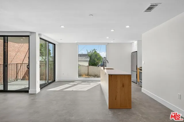 a view of an empty room with a fireplace