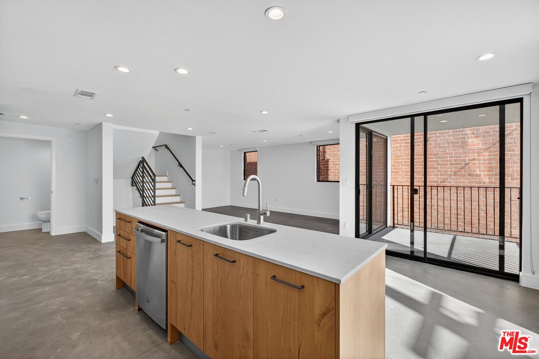 2412 Eads Street, Unit 7 Los Angeles, CA 90031 - Photo 13 of 29 a kitchen with stainless steel appliances granite countertop a sink and a stove