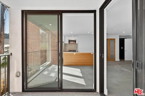 a view of a bathroom with a glass door