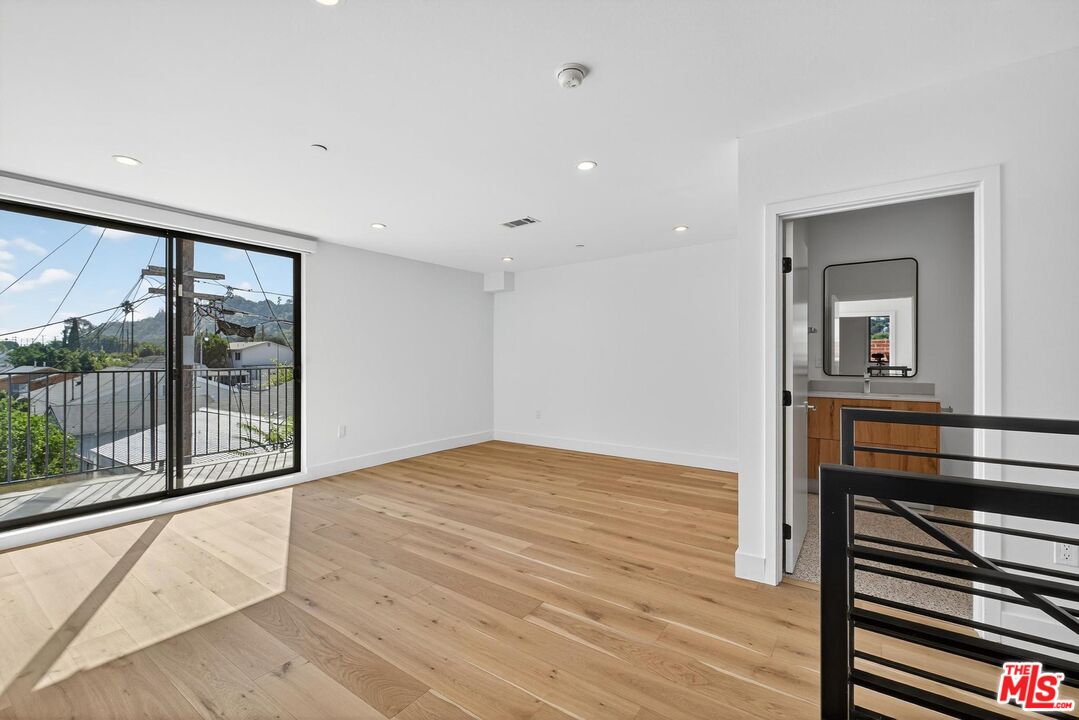 2412 Eads Street, Unit 7 Los Angeles, CA 90031 - Photo 16 of 29 a view of an empty room with wooden floor and a window