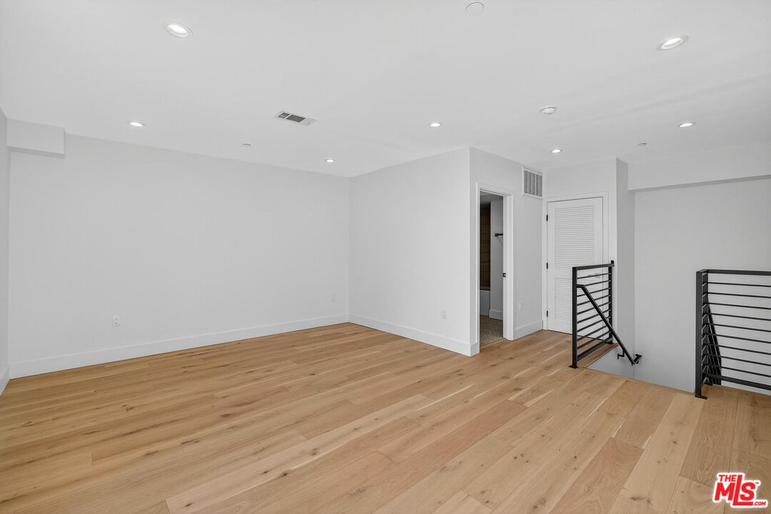 2412 Eads Street, Unit 7 Los Angeles, CA 90031 - Photo 17 of 29 a view of empty room with wooden floor