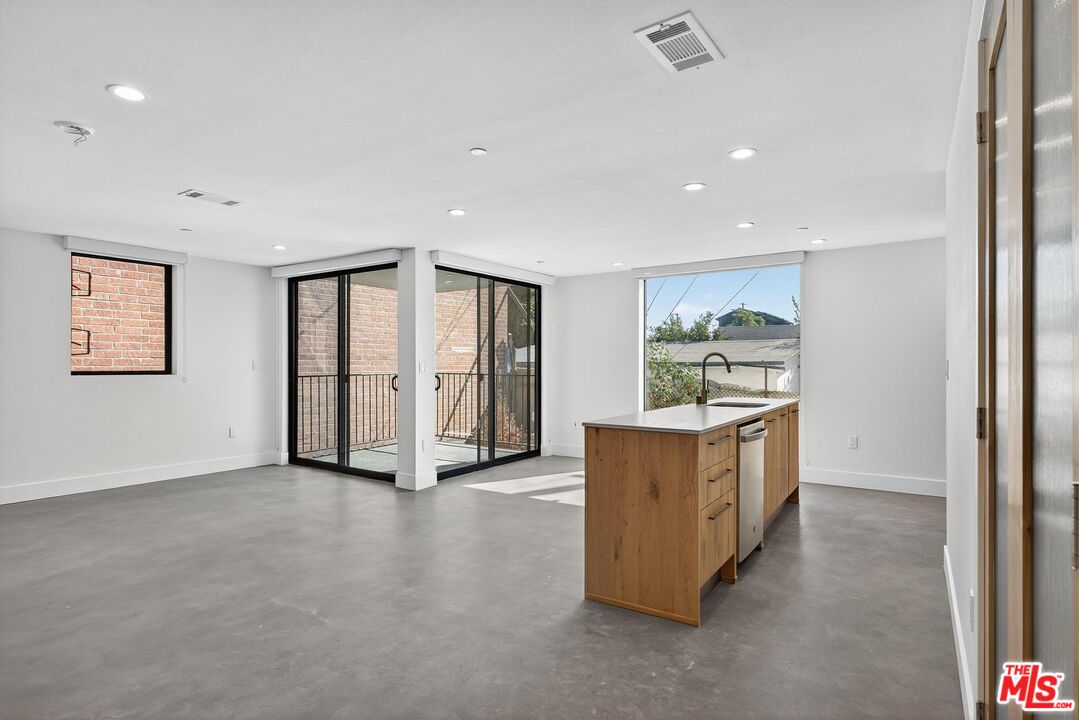 2412 Eads Street, Unit 7 Los Angeles, CA 90031 - Photo 2 of 29 a view of a big room with furniture and windows