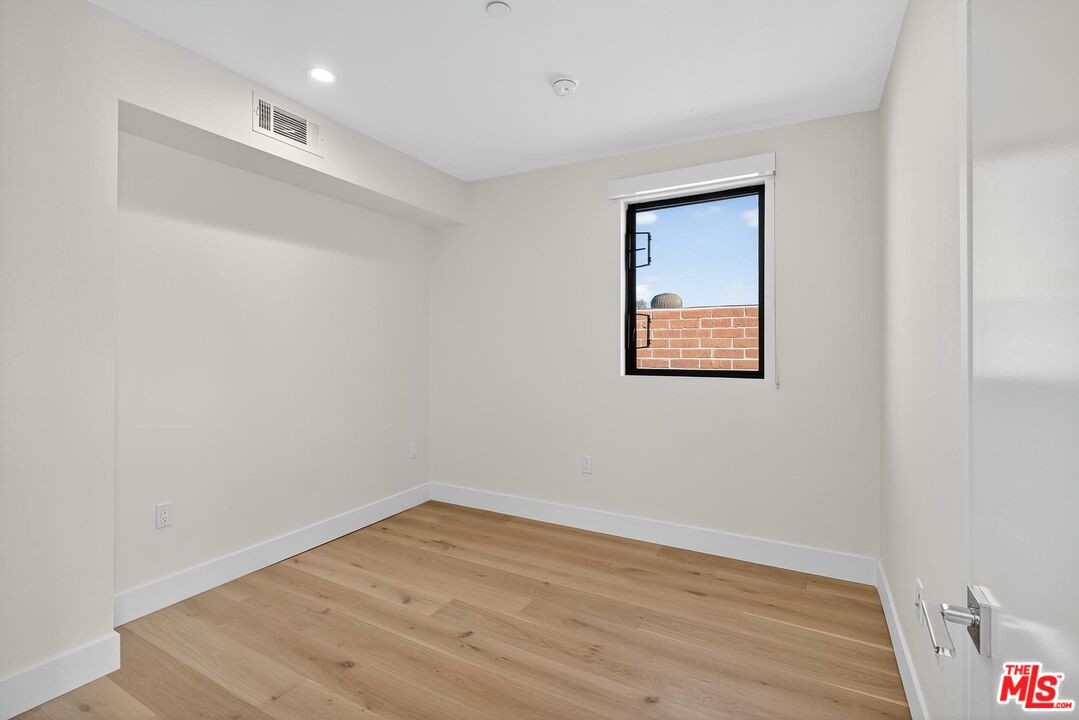 2412 Eads Street, Unit 7 Los Angeles, CA 90031 - Photo 21 of 29 a view of empty room with wooden floor
