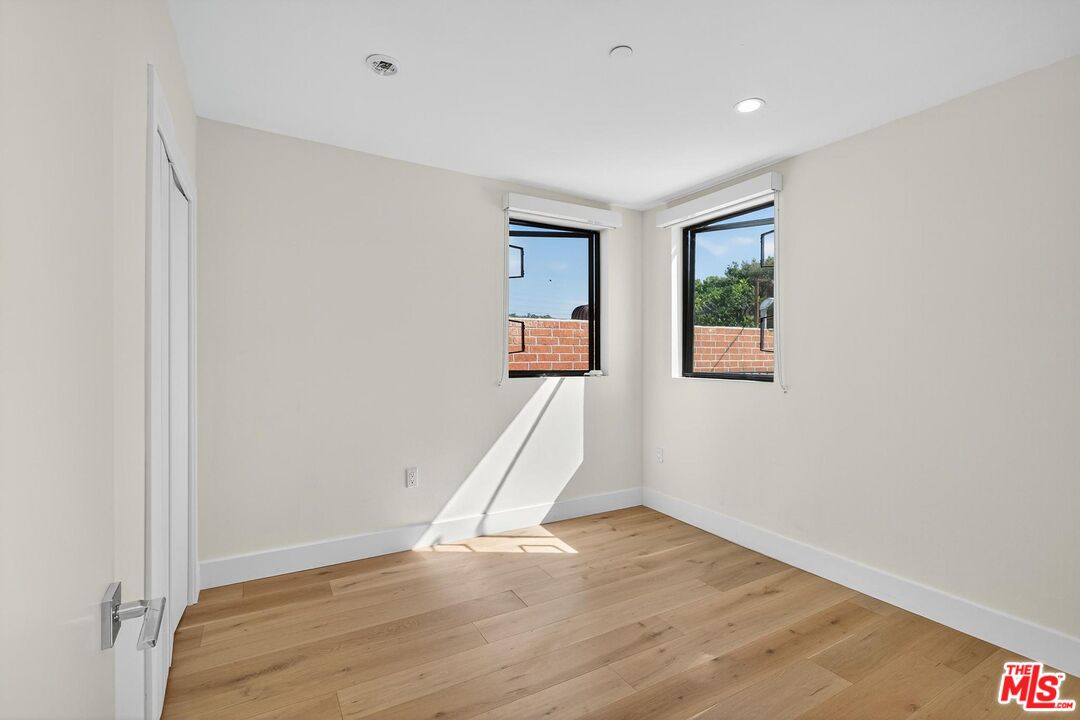 2412 Eads Street, Unit 7 Los Angeles, CA 90031 - Photo 23 of 29 an empty room with wooden floor and a window
