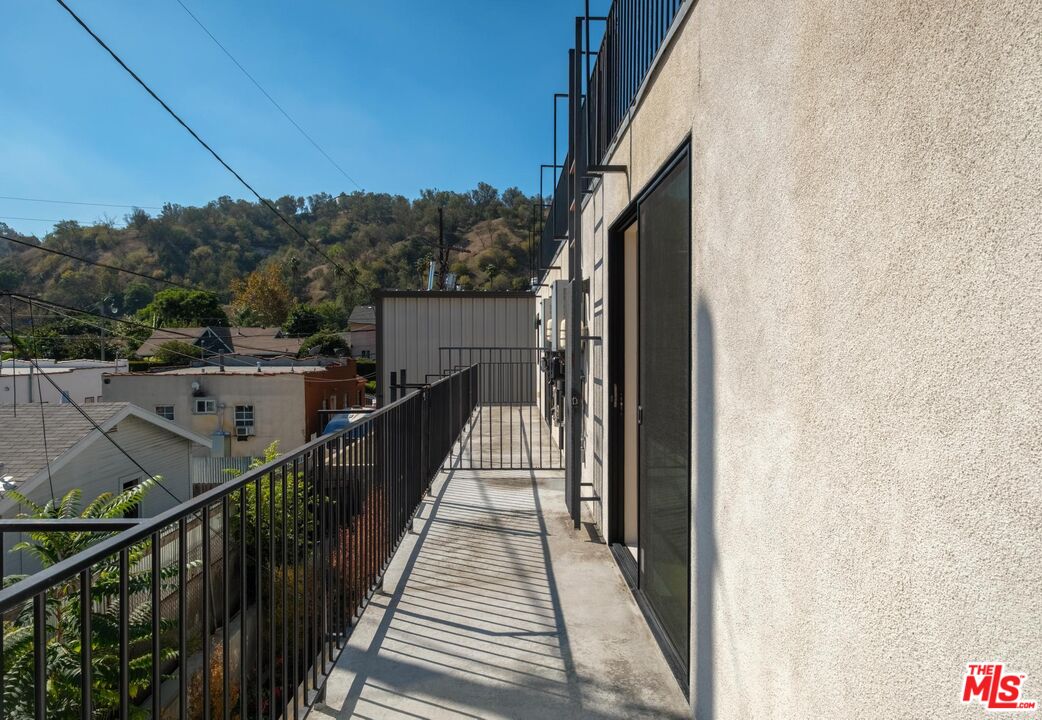 2412 Eads Street, Unit 7 Los Angeles, CA 90031 - Photo 5 of 29 a view of balcony with wooden floor and fence
