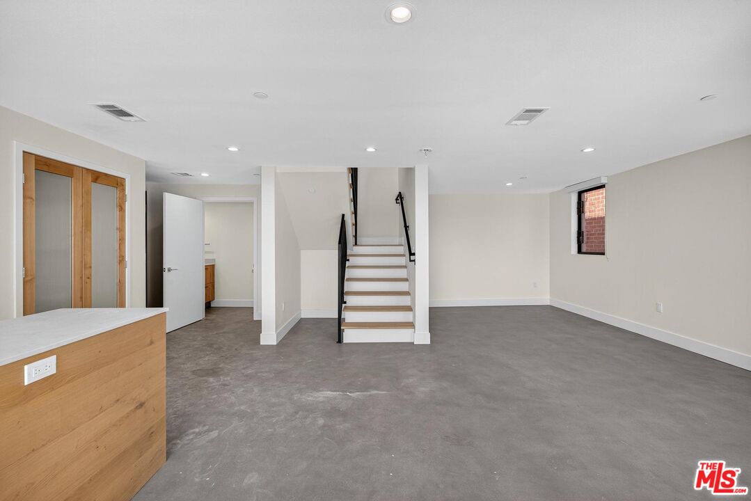 2412 Eads Street, Unit 7 Los Angeles, CA 90031 - Photo 9 of 29 a view of a livingroom with stairs and closet