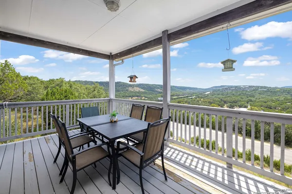 a view of a balcony with furniture