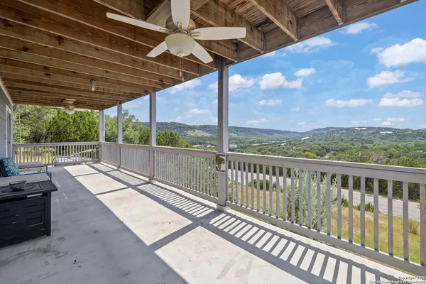 a view of balcony with wooden floor