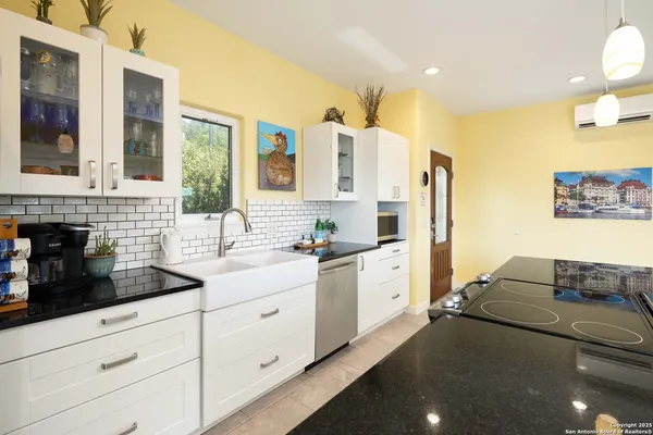 a kitchen with stainless steel appliances a sink stove and refrigerator