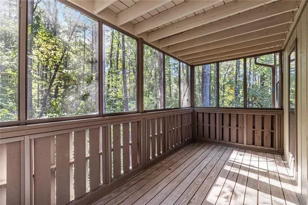 a view of wooden balcony with wooden floor