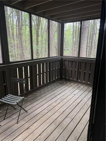 a view of balcony with wooden floor
