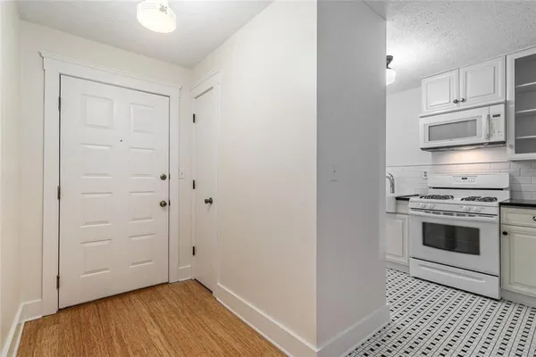 a kitchen with a stove and a microwave