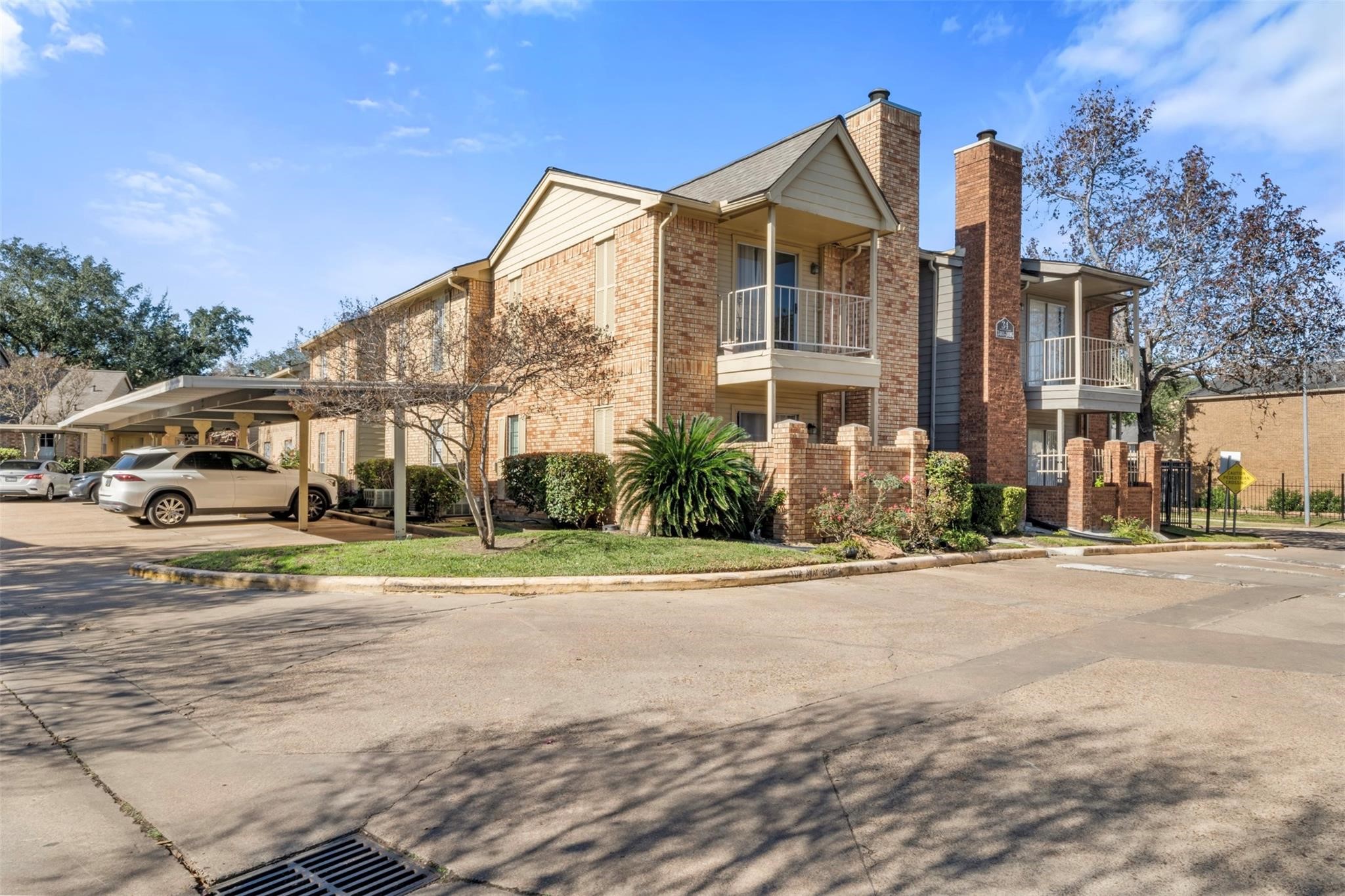 1515 Sandy Springs Road, Unit 1006 Houston, TX 77042 - Photo 24 of 35 a view of a parked cars in front of a building